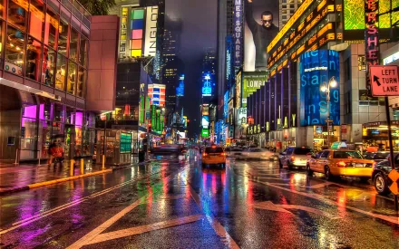 A vibrant view of a rainy Times Square in Manhattan, New York, showcasing colorful lights reflecting on wet streets, creating a dynamic urban atmosphere.