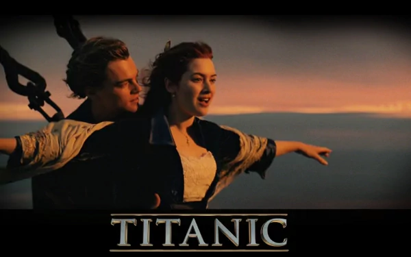 HD desktop wallpaper of Leonardo DiCaprio and Kate Winslet from the movie Titanic, featuring the iconic scene on the ship's bow at sunset.