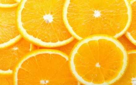 Close-up of vibrant orange slices forming a colorful, fresh food-themed HD desktop wallpaper background.