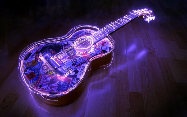 A vibrant guitar illuminated with colorful light effects, resting on a wooden floor, serves as an engaging HD desktop wallpaper and background for music enthusiasts.