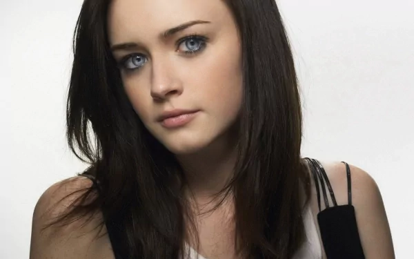 HD PC desktop wallpaper featuring a close-up portrait of celebrity Alexis Bledel with dark hair and blue eyes against a plain white background.