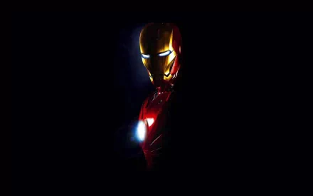 HD desktop wallpaper of Iron Man from the movie, featuring a dramatic, dark background with the illuminated suit.