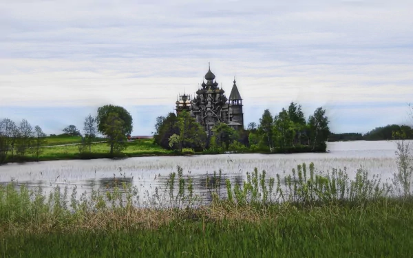 HD desktop wallpaper of a historic wooden church surrounded by trees and reflected in calm water under a cloudy sky, blending religious architecture with natural beauty.