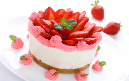 A vibrant strawberry cake adorned with fresh strawberries and decorative pink frosting, presented on a white plate. This HD wallpaper captures the essence of delicious dessert.