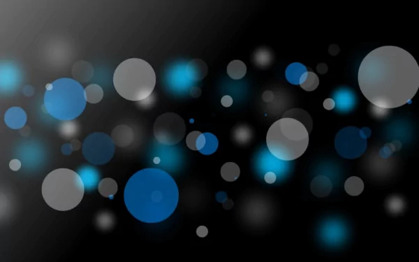 A visually captivating HD desktop wallpaper featuring an artistic arrangement of grey and blue circles, enhanced by a bokeh effect against a dark background.