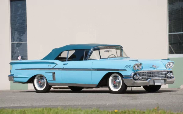 A pristine 1958 Chevrolet Impala convertible in light blue, showcased as an HD PC desktop wallpaper and background.