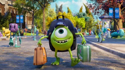 Mike Wazowski from Monsters University carries two suitcases, wearing a cap, as he walks through a vibrant campus filled with greenery and animated characters. HD desktop wallpaper.