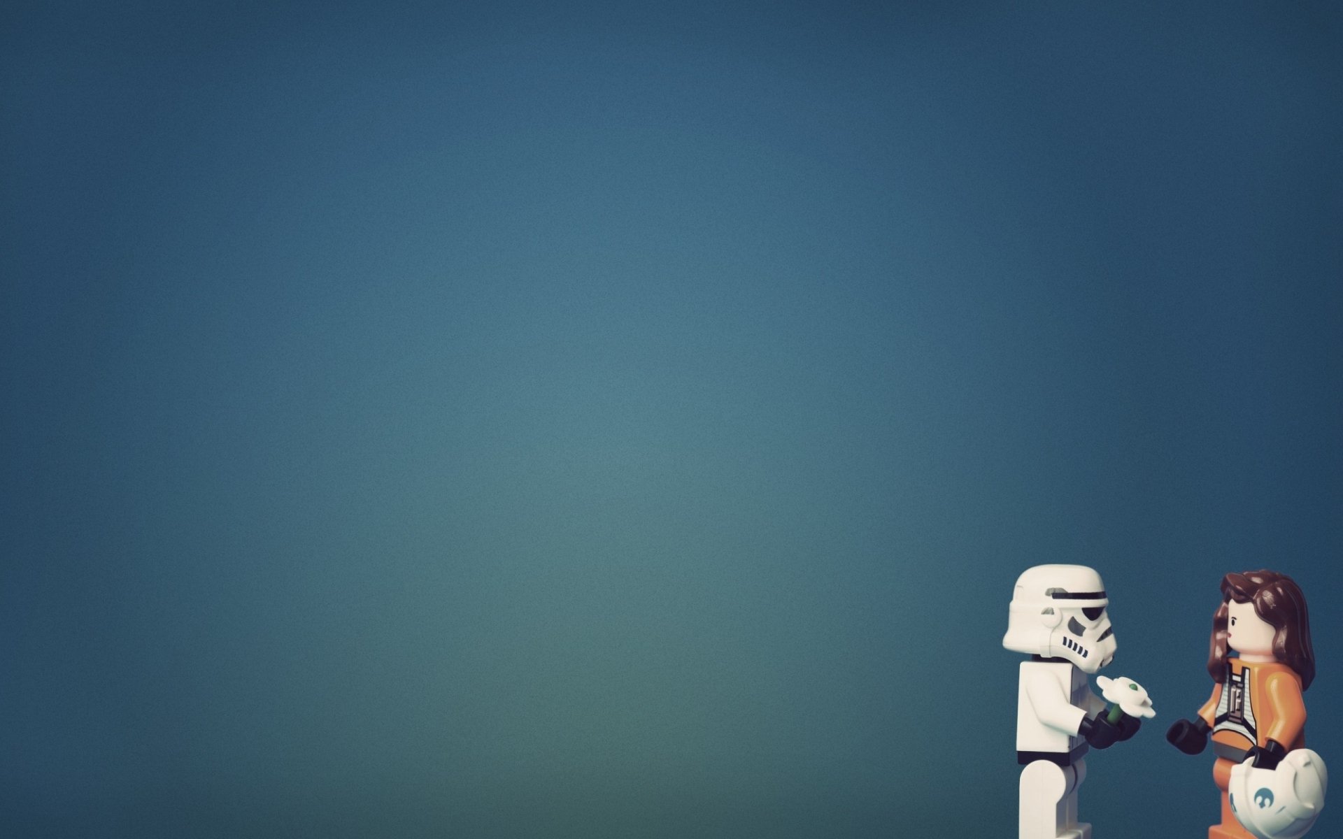 HD PC desktop wallpaper featuring man-made LEGO figures of a stormtrooper and another character against a minimalist blue background.
