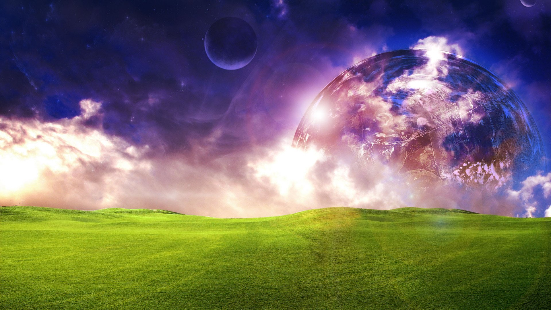A vibrant HD PC desktop wallpaper featuring a lush green field under a dreamy sky with glowing clouds and a large, otherworldly planet in the background.