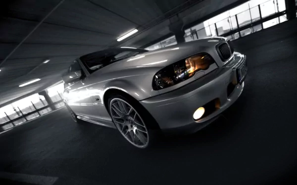 Silver BMW 3 Series parked in a dimly lit garage, showcased in crisp 4K Ultra HD as a stylish PC desktop wallpaper and background.