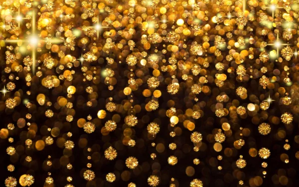 Bokeh effect in golden hues creates a shimmering, artistic backdrop, enhancing your HD PC desktop wallpaper with eye-catching depth and vibrancy.