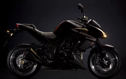 HD PC desktop wallpaper featuring a sleek black Kawasaki Z1000 motorcycle against a dark background, highlighting its sharp design and powerful stance.