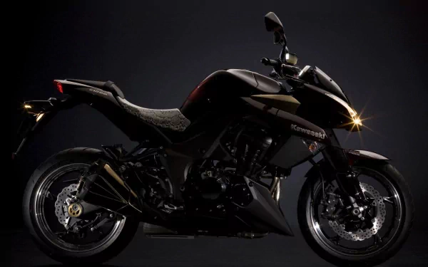 HD PC desktop wallpaper featuring a sleek black Kawasaki Z1000 motorcycle against a dark background, highlighting its sharp design and powerful stance.