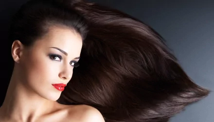 Close-up of a woman with long flowing dark hair and red lipstick, featured in a 4K Ultra HD PC desktop wallpaper background.