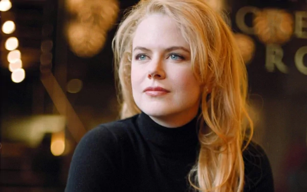 A close-up of Nicole Kidman, featuring her with long blonde hair and a thoughtful expression. This HD image serves as a vibrant PC desktop wallpaper or background.