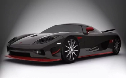 A striking Koenigsegg CCX in sleek black with red accents, showcased against a minimalist background, making for an impressive HD PC desktop wallpaper and background.