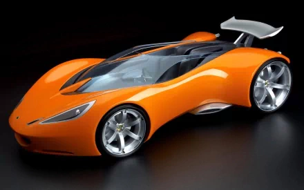 HD PC desktop wallpaper featuring a sleek, orange Lotus Hot Wheels concept vehicle with aerodynamic curves and a prominent rear spoiler against a dark background.