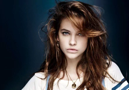 HD desktop wallpaper and background featuring celebrity Barbara Palvin with tousled hair and a serious expression against a blue gradient backdrop.