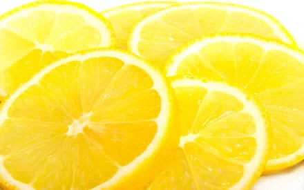 Close-up of bright sliced lemons, a food-themed vibrant yellow texture used as an HD PC desktop wallpaper background.
