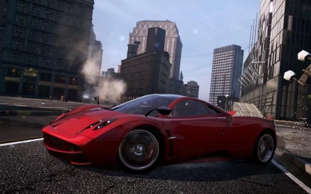 HD PC desktop wallpaper featuring a sleek red sports car speeding through a cityscape from the video game Need For Speed: Most Wanted.
