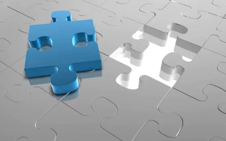 HD 3D CGI image of a blue man-made puzzle piece positioned beside its corresponding empty slot on a reflective, silver puzzle surface, designed as a desktop wallpaper.