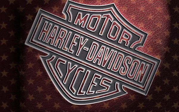 Harley-Davidson logo embossed on a textured background, featured as an HD PC desktop wallpaper showcasing the iconic motorcycle brand.