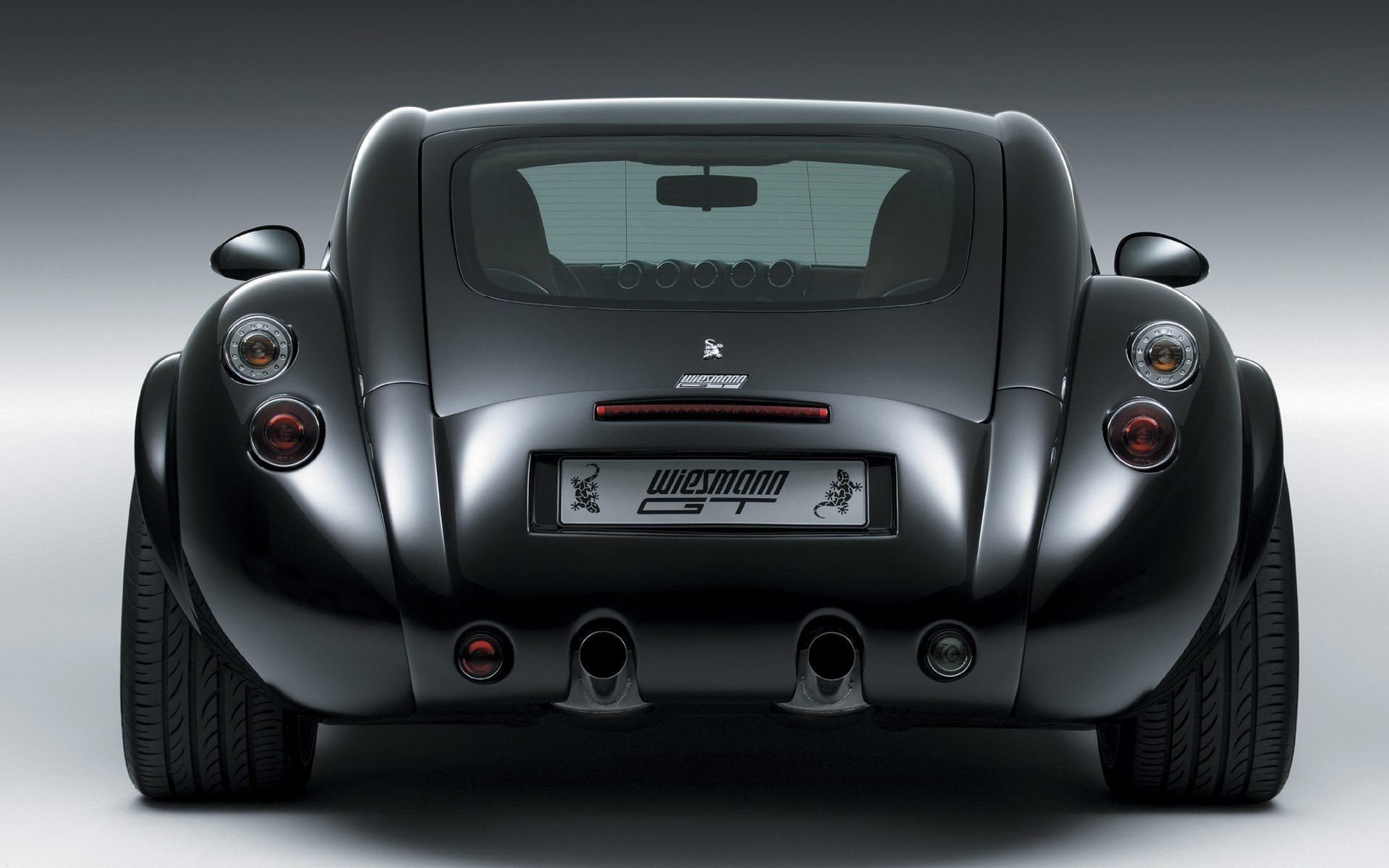 Rear view of a black Wiesmann GT MF4 sports car on a smooth gradient — HD PC desktop wallpaper and background.