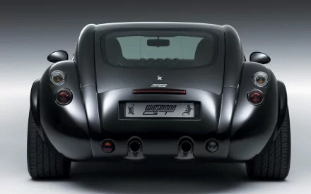 Rear view of a black Wiesmann GT MF4 sports car on a smooth gradient — HD PC desktop wallpaper and background.