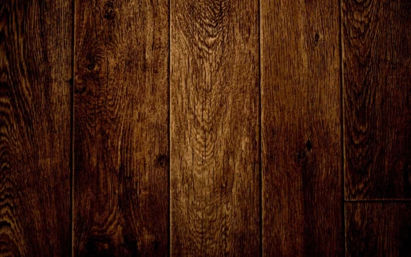 A close-up view of rich, textured wooden planks, showcasing an artistic design. This HD wallpaper enhances any desktop background with its natural warmth.