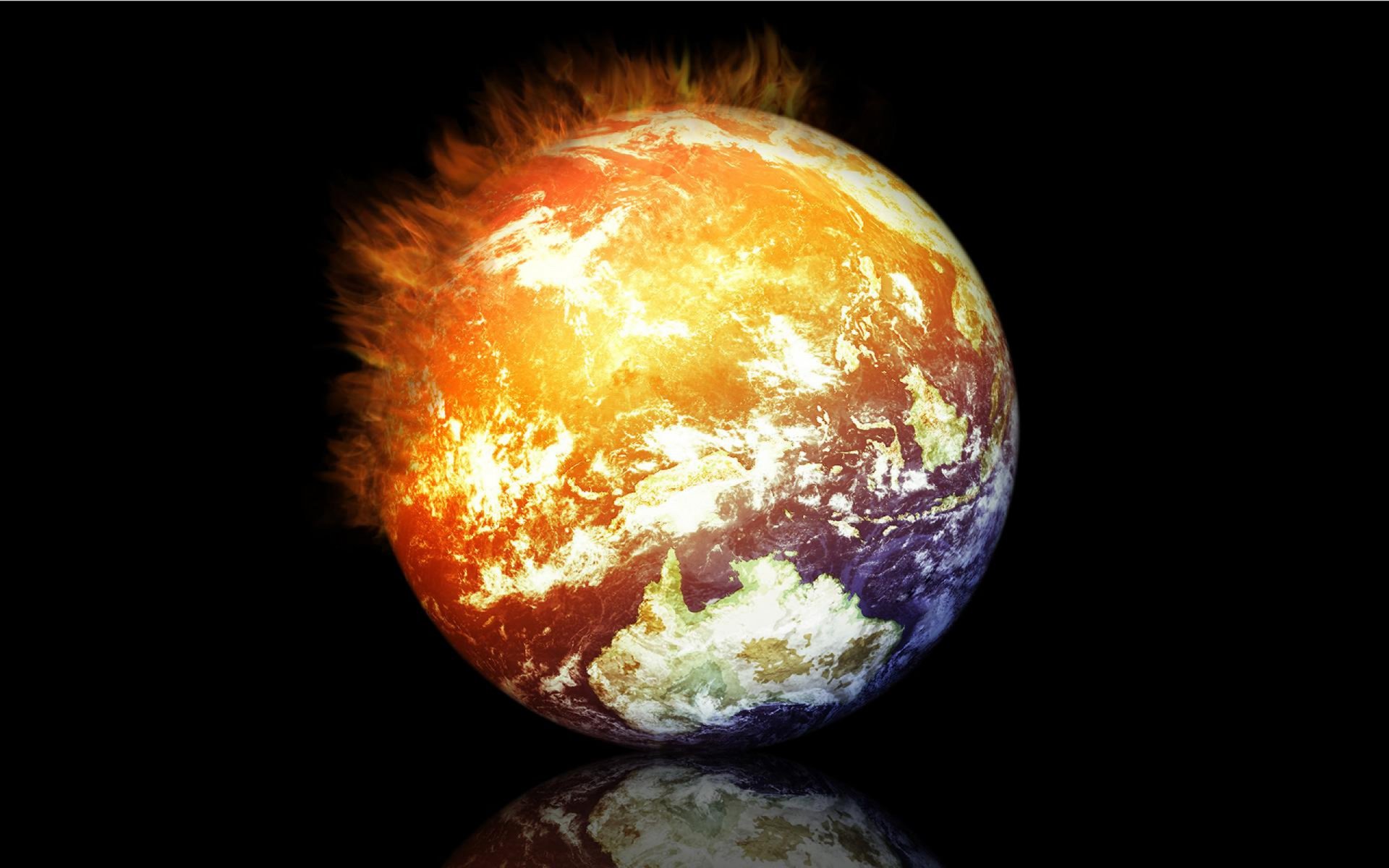 Fiery Earth from space with glowing atmosphere reflected on a dark surface — nature-themed 2K Quad HD PC desktop wallpaper/background.