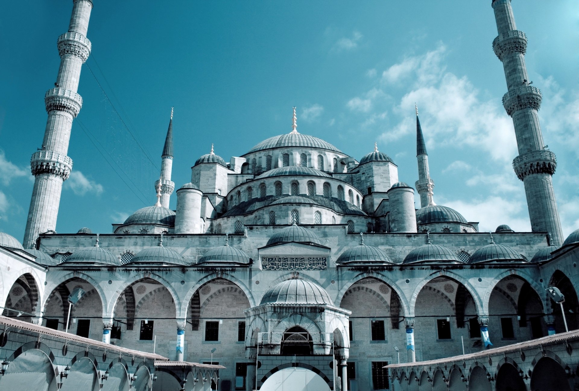 A stunning HD wallpaper featuring the iconic Hagia Sophia, showcasing its grand architecture and serene atmosphere, complemented by a clear blue sky.