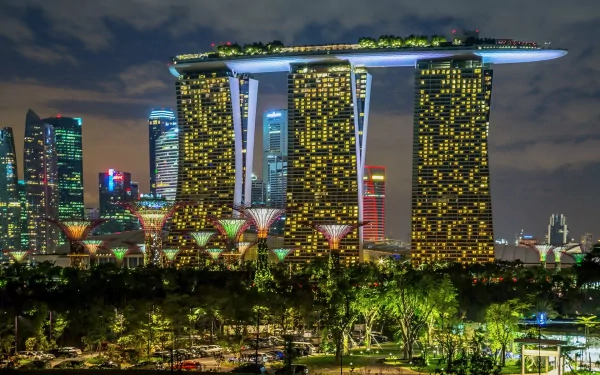 A striking night view of Singapore’s iconic Marina Bay Sands, showcasing its futuristic architecture and vibrant city lights, making for an impressive HD desktop wallpaper.