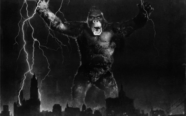 HD PC desktop wallpaper featuring King Kong from the 1933 movie, depicted roaring amidst a stormy night over a city skyline with lightning striking.