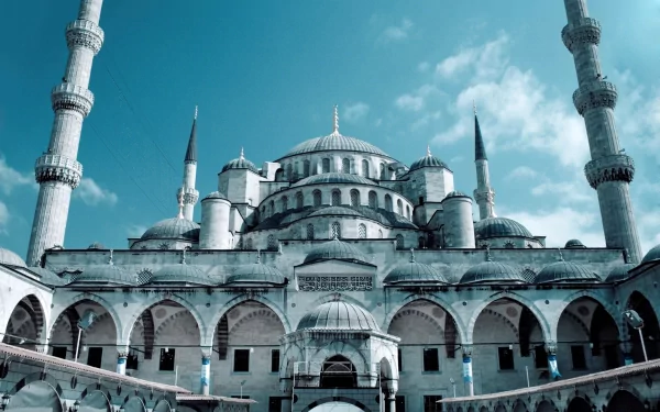A stunning HD wallpaper featuring the iconic Hagia Sophia, showcasing its grand architecture and serene atmosphere, complemented by a clear blue sky.