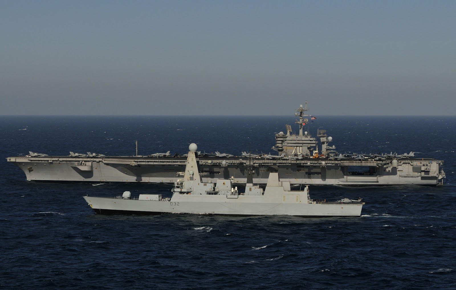 HD PC desktop wallpaper: US Navy aircraft carrier USS Carl Vinson (CVN-70) steaming at sea with an escorting warship.