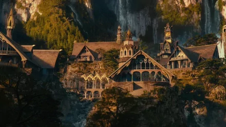 A stunning HD desktop wallpaper depicting a fantasy landscape inspired by The Lord of the Rings, featuring an intricately designed elven architecture nestled among lush greenery.