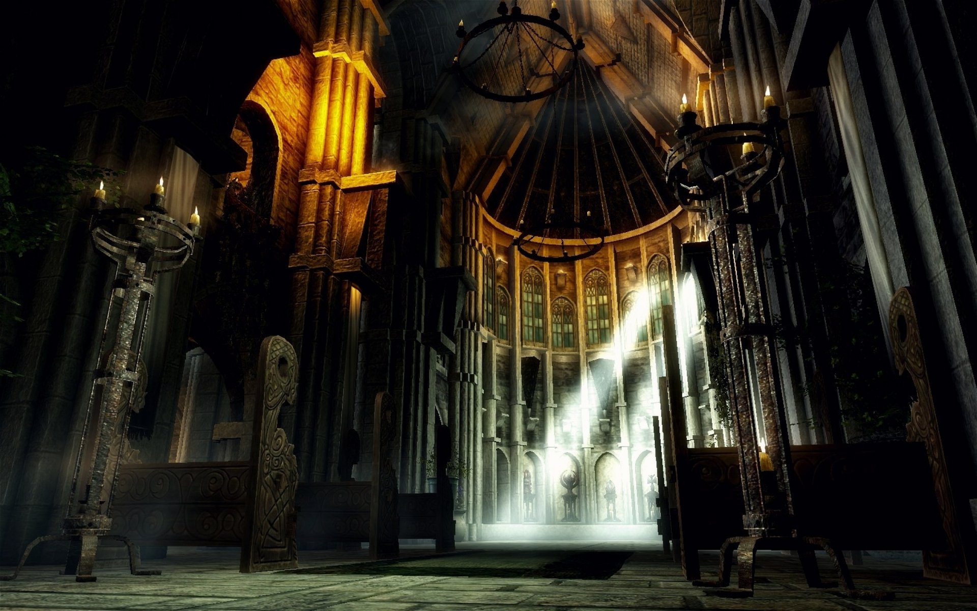HD PC desktop wallpaper from the video game The Elder Scrolls V: Skyrim featuring an atmospheric interior with stone pillars and beams of light filtering through high windows.