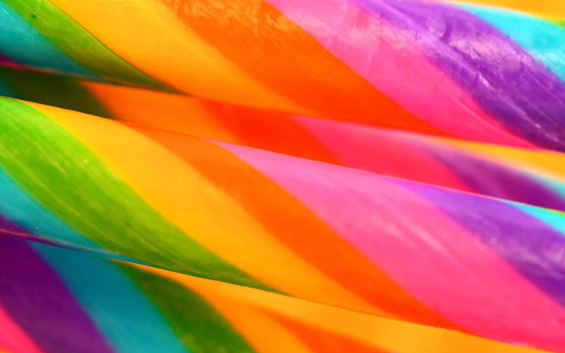 Vibrant close-up of colorful twisted candy stripes, captured in HD for a bright and lively PC desktop wallpaper background.