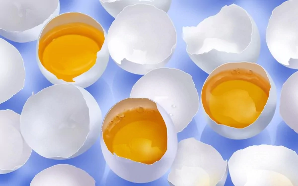 HD PC desktop wallpaper featuring multiple cracked white eggshells with vibrant yellow yolks against a soft blue background.