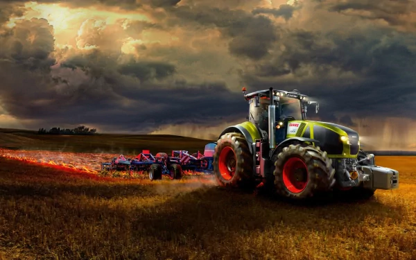 A Claas Axion 990 tractor works in a golden field under dramatic clouds, highlighting its robust design and powerful performance against a scenic rural backdrop.