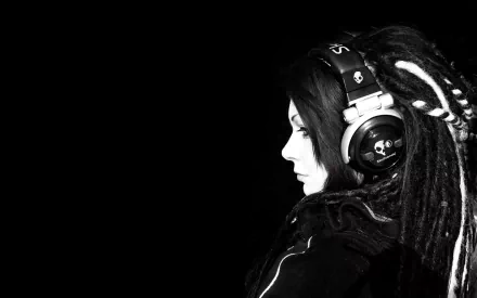 Monochrome music-themed 2K Quad HD PC desktop wallpaper: side profile of a person with dreadlocks wearing large headphones against a deep black background.