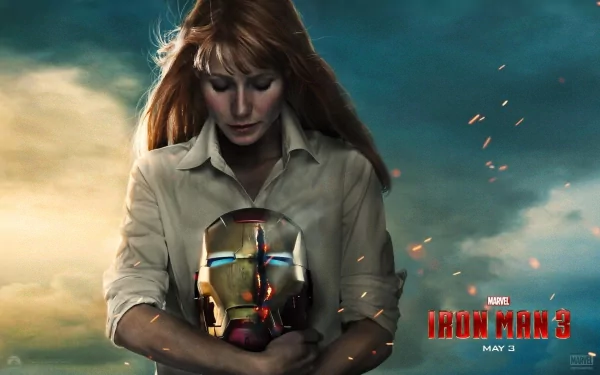 Gwyneth Paltrow as Pepper Potts holds Iron Man's helmet in a dramatic scene from Iron Man 3, set against a striking HD backdrop with cinematic flair.