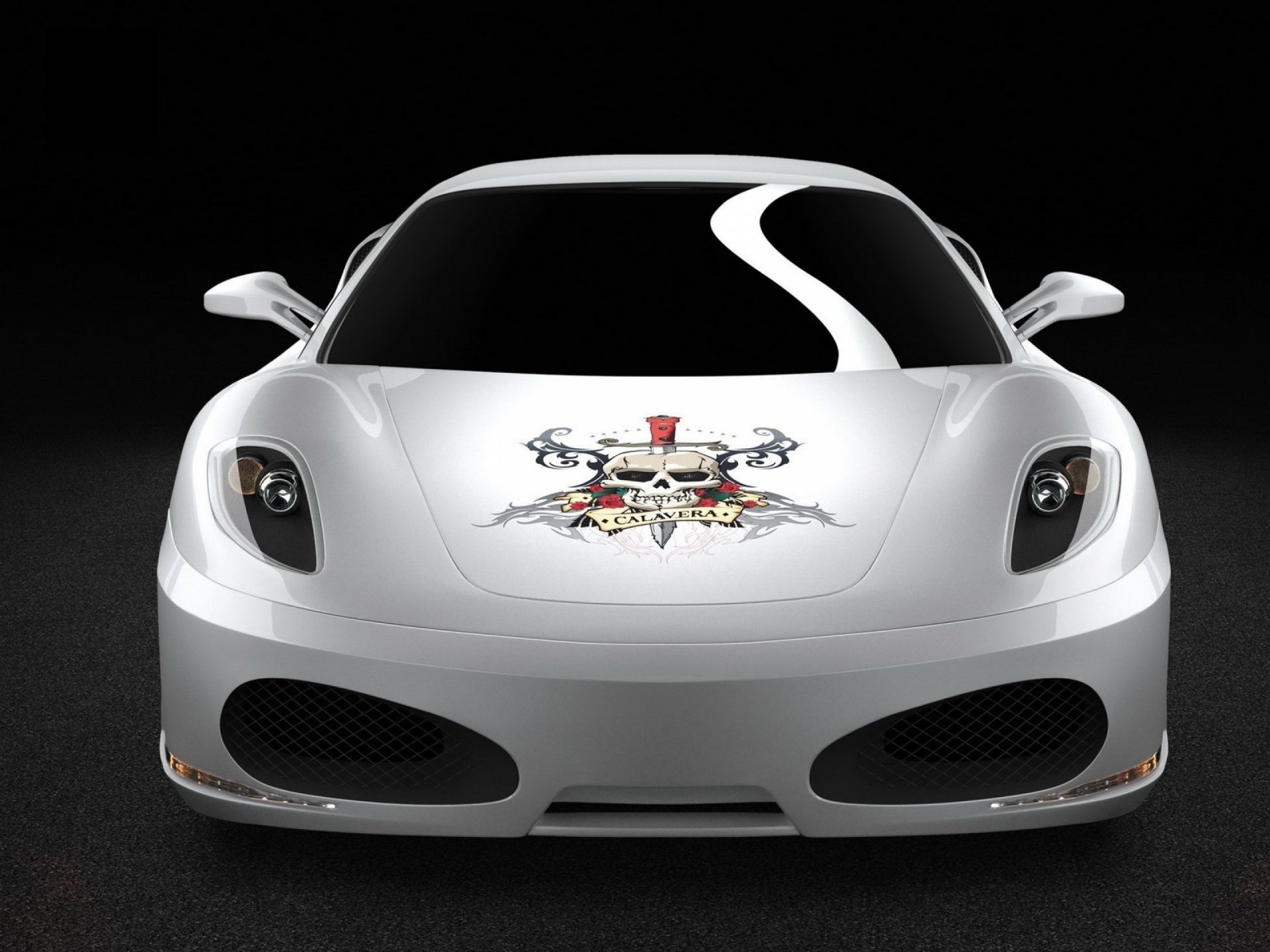 Front view of a white Ferrari F430 vehicle with skull crest hood decal on a black backdrop — 2K Quad HD PC desktop wallpaper/background.