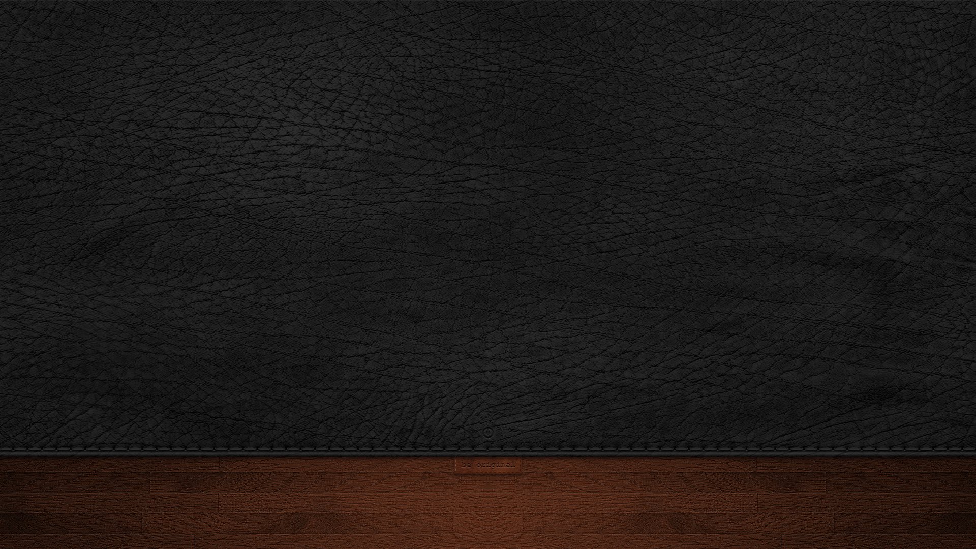 Abstract textured HD desktop wallpaper featuring a black leather-like surface above a dark wooden panel background.