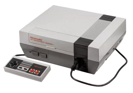 Retro Nintendo Entertainment System console with controller on white background — video game 2K Quad HD PC desktop wallpaper and background.