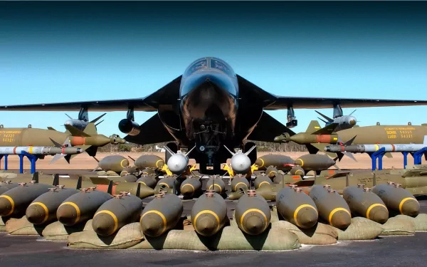 HD desktop wallpaper featuring a military General Dynamics F-111 Aardvark jet with an array of bombs displayed in the foreground on a runway.