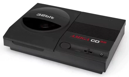 HD desktop wallpaper featuring a classic Amiga CD32 video game console in sleek black with 32-bit branding.