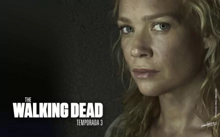 HD wallpaper featuring Laurie Holden as Andrea from the TV show The Walking Dead, Season 3. The image captures her intense expression and highlights the show's dramatic tone.