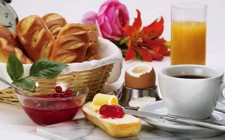 A delightful breakfast scene featuring fresh bread with butter and jam, a soft-boiled egg, coffee, juice, and vibrant flowers, creating an inviting still life for a kitchen setting.