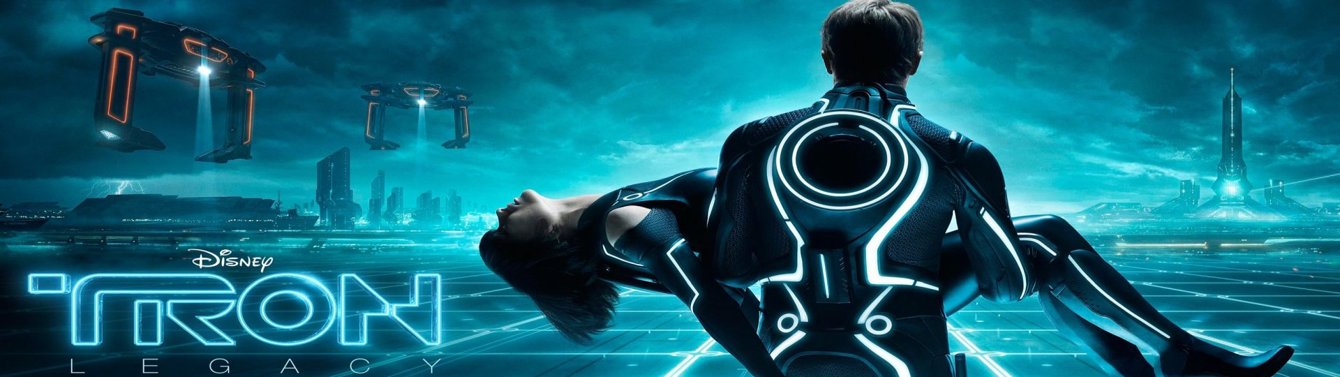 HD PC desktop wallpaper and background from the movie TRON: Legacy — glowing-suited figure carries a woman across a neon grid cityscape beneath a teal, stormy sky.